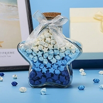 The glass bottle of lucky stars with folded stars in the pentagon stars of the wooden jar wishes for 520 stars
