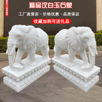 A pair of stone elephants White marble sunset red and blue stone baby elephants Lucky stone elephant ornaments on the doorstep of the hotel villa