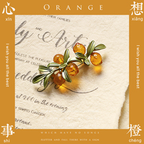 I think about the orange plant brooch the leaves the fruit the good wishes of the literary and the men and women the birthday gift.