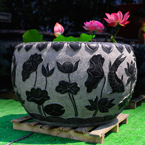 Outdoor Chinese green stone sculpted lotus fish tank round water cylinder imitation ancient stone groove courtyard stone cylinder flowing water for making a view swing piece