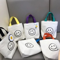 Women's 2021 new tide smiling face canvas bag handbag printed Han Feng bucket bag small lunch box bag mommy bag