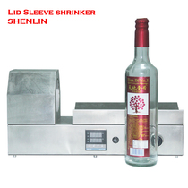  Red wine bottle plastic cap shrink machine Bottle cap sleeve film shrink machine Wine bottle trademark shrink machine Shenzhen plastic cap shrink