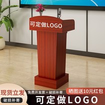The podium the reception desk the reception desk the shopping guide the host of the ceremony the host of the ceremony
