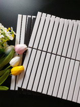 Long rectangular strip mosaic ceramic background wall black and white ceramic tile Japanese luxury sanitary toilet interior wall