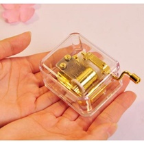 Creative gift music box Crystal music box Acrylic transparent hand-cranked cannon to send male and female couples Sky city