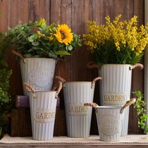 American countryside decorated with flowers barrel dried flower barrel flower shop decorated with tin barrel retro made of old vases floor flower pots