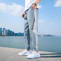  Pants mens trend brand Korean version of the trend 2021 spring thin nine-point ice silk sports tie-foot tooling casual trousers