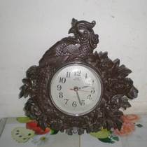 Wenxingfang produces Tianjin Great Wall brand solid wood carving Phoenix shape quartz wall clock clock clock