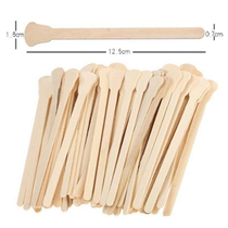Mask wood rod with one-time hair removal rod on wax to apply honey wax removal and brow wood sign small double use