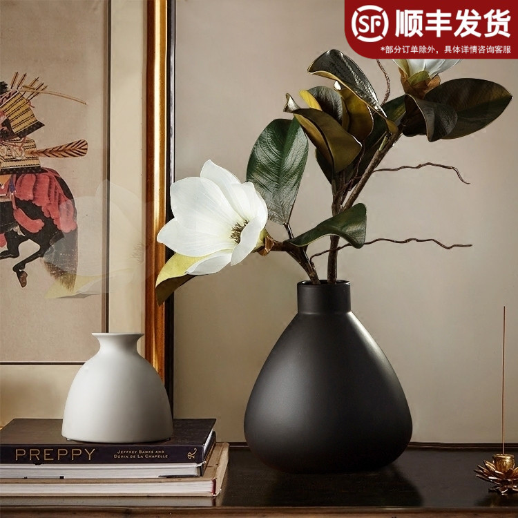 Modern minimalist black ceramic vases creatively decorate the dining room living room with home flower inserts hand-zen